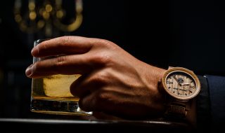 Man drinking while wearing the Original Grain Jim Beam Whiskey Barrel Watch