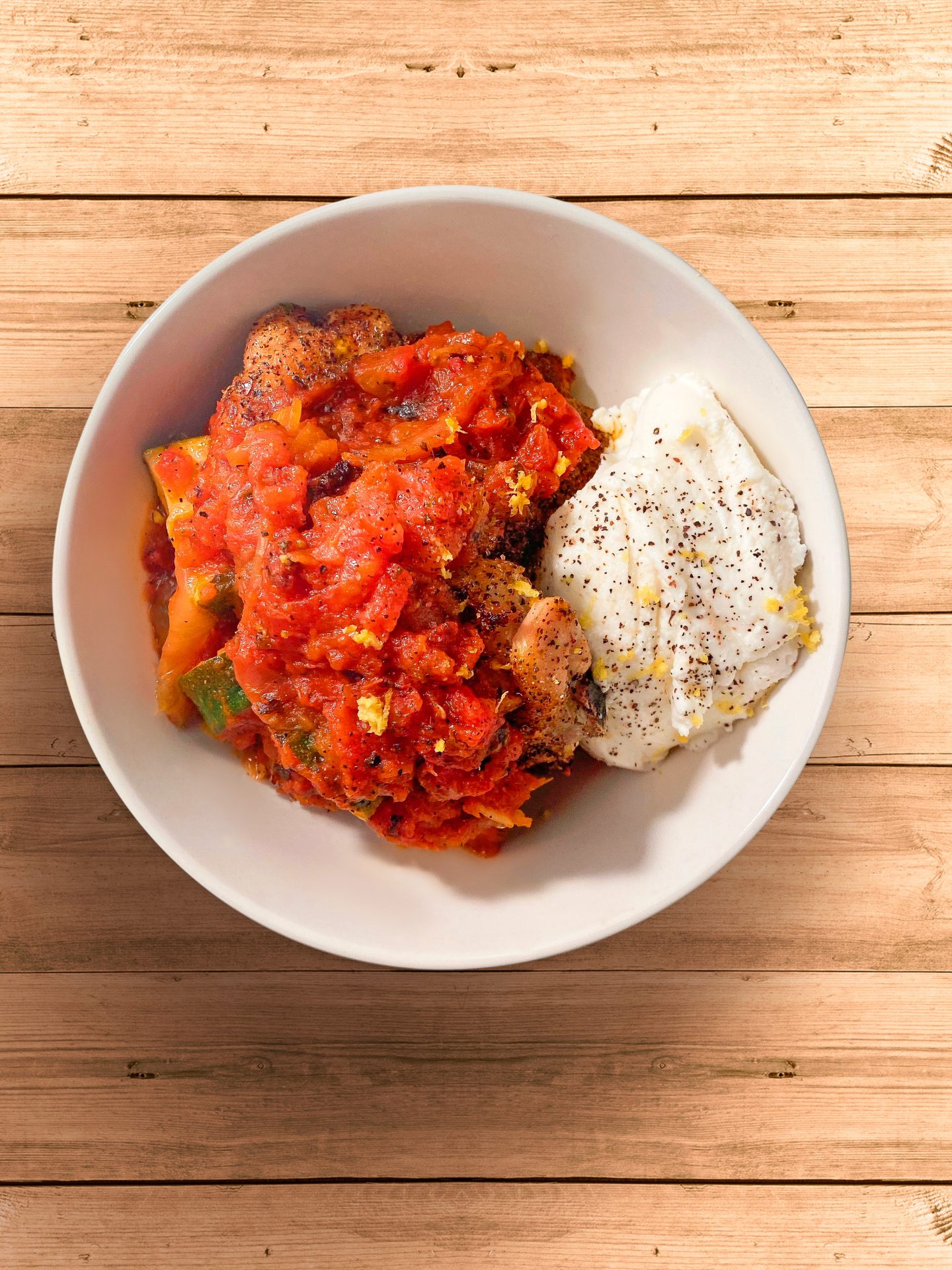 Oven-baked chicken with zucchini & caramelized onion tomato sauce